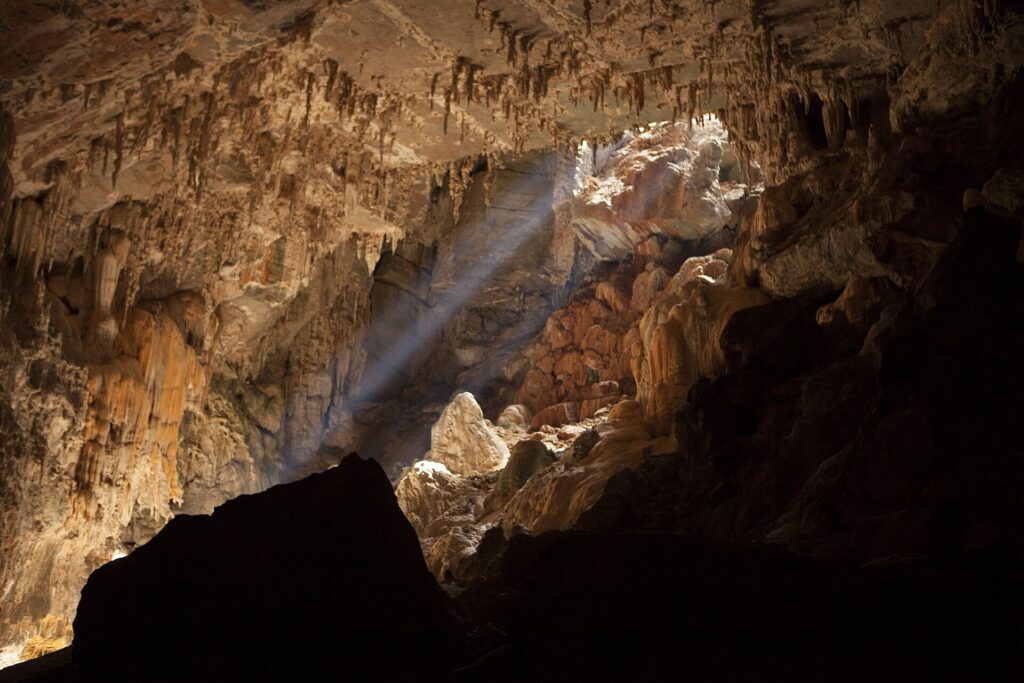 Terra Ronca cave chamber with light beam