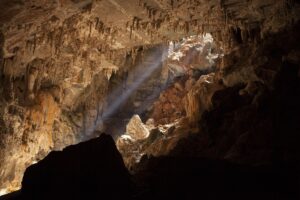 Terra Ronca cave chamber with light beam