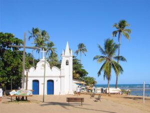 White church among palms at Praia do Forte, Bahia